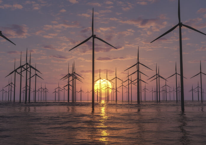 sunrise at an offshore wind farm Il costo dell'energia
