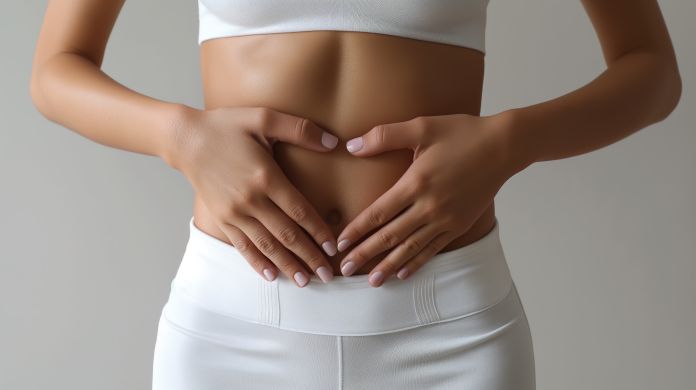 woman belly with hearth hand. Take care of your health. You are what you eat concept. for beauty underwear fitness weight loss advertising. Microbioma