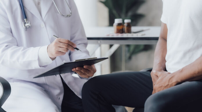 Man having appointment with STD specialist in clinic, closeup HPV